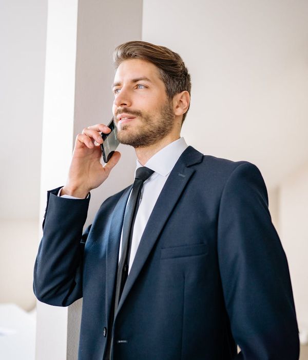 Man in formal business attire with confident expression