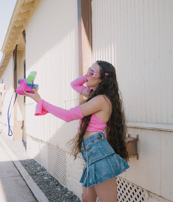 Woman in contemporary business outfit with warm expression